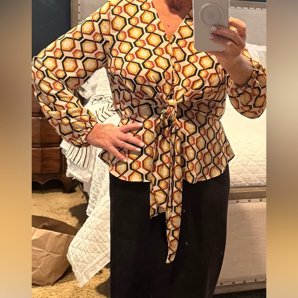 Geometric peplum tie front blouse